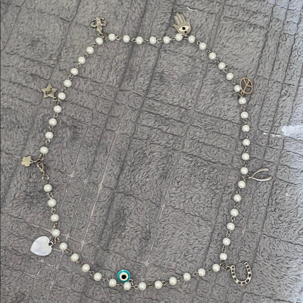Beautiful pearl necklace with multiple charms !